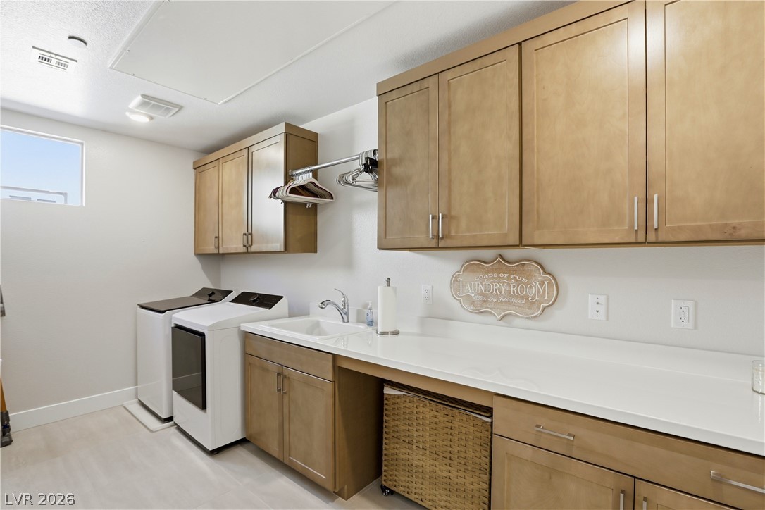 4159 Solace Street, Unit 2 Las Vegas, NV 89135 - Photo 43 of 71 Spacious, separate laundry room with upgraded cabinetry and sink.