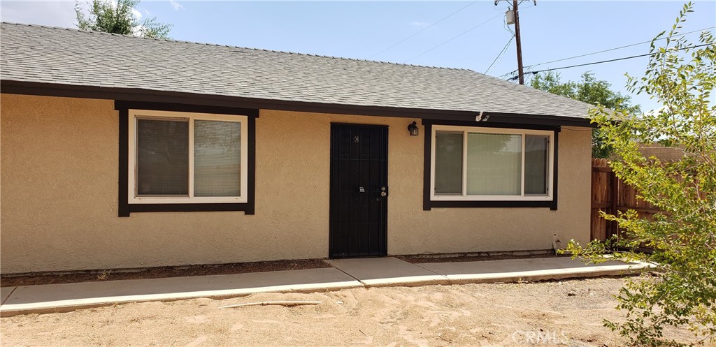 13444 Mohawk Road, Unit C Apple Valley, CA 92308 - Photo 1 of 1 a front view of a house