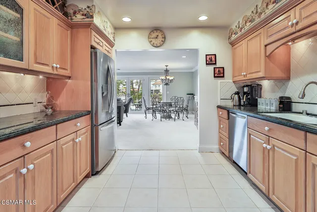 a view of a two chairs and table in the balcony