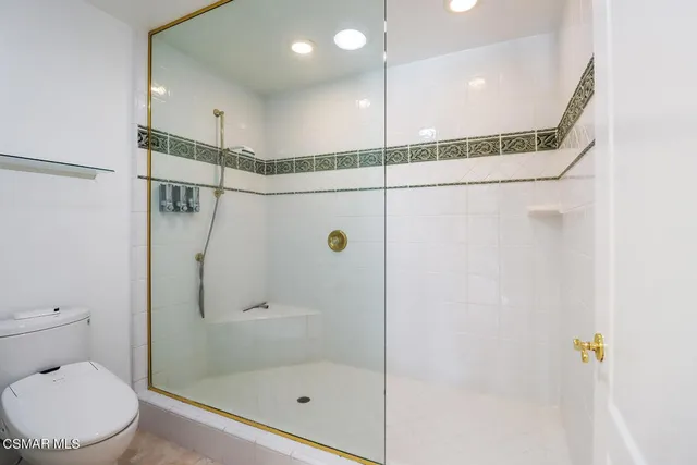 a kitchen with stainless steel appliances granite countertop a sink a stove and a microwave