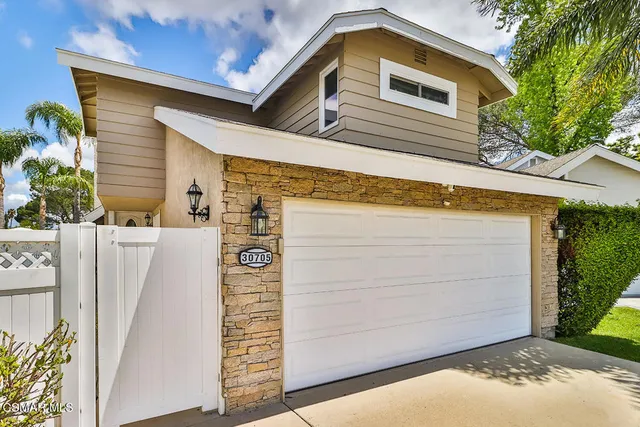 a view of a lake with a house swimming pool and outdoor space