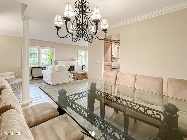 a view of walk in closet with wooden floor and entryway