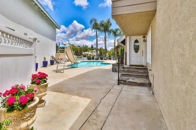 a kitchen with stainless steel appliances a refrigerator sink and microwave