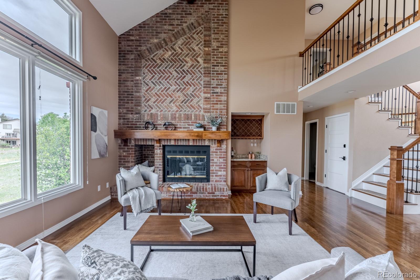 1914 Terrace Drive Highlands Ranch, CO 80126 - Photo 3 of 47 a living room with fireplace furniture and a fireplace