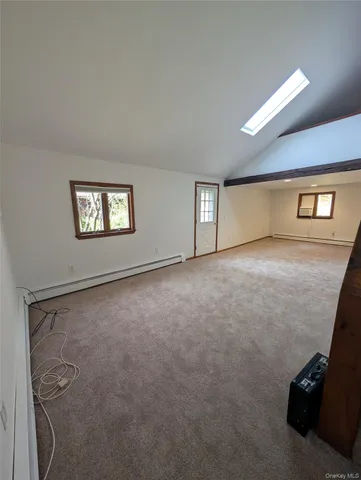 a view of an empty room with windows