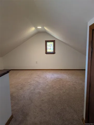 an empty room with a bench