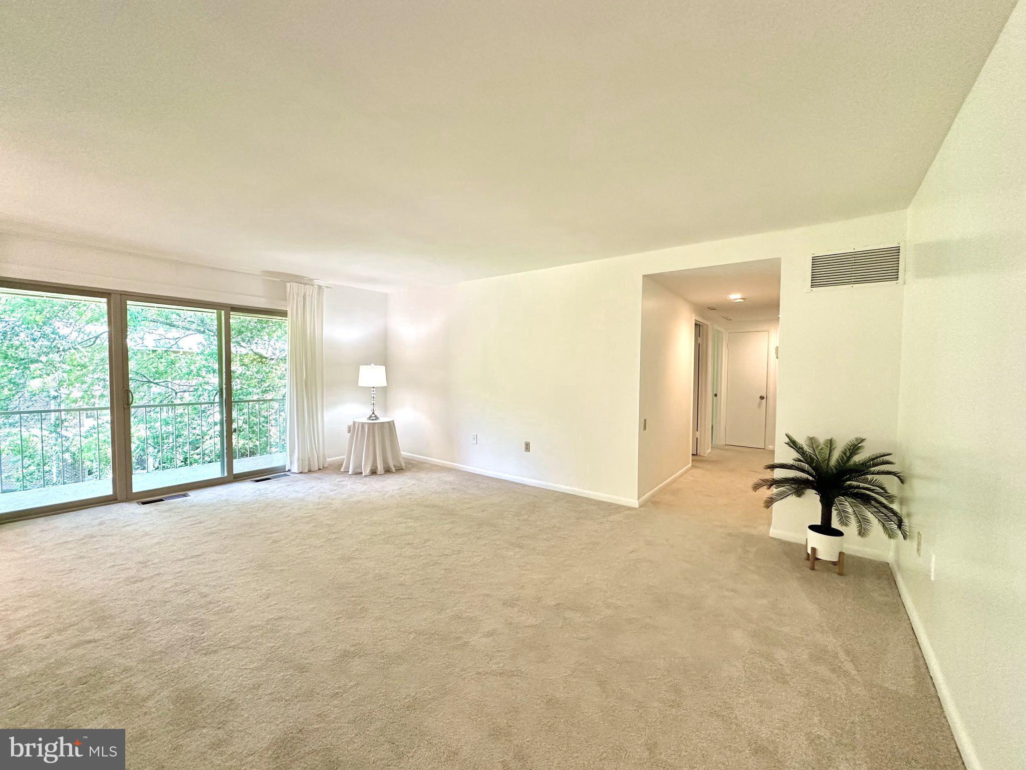 3350 Chiswick Court, Unit 573C Silver Spring, MD 20906 - Photo 12 of 43 Living room has access to balcony