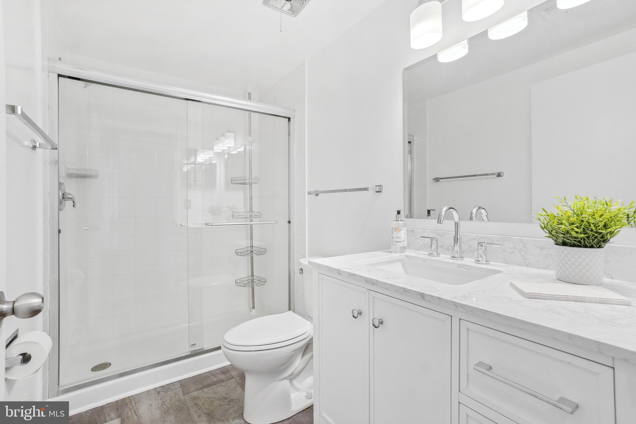 3350 Chiswick Court, Unit 573C Silver Spring, MD 20906 - Photo 18 of 43 a bathroom with a sink a toilet and shower