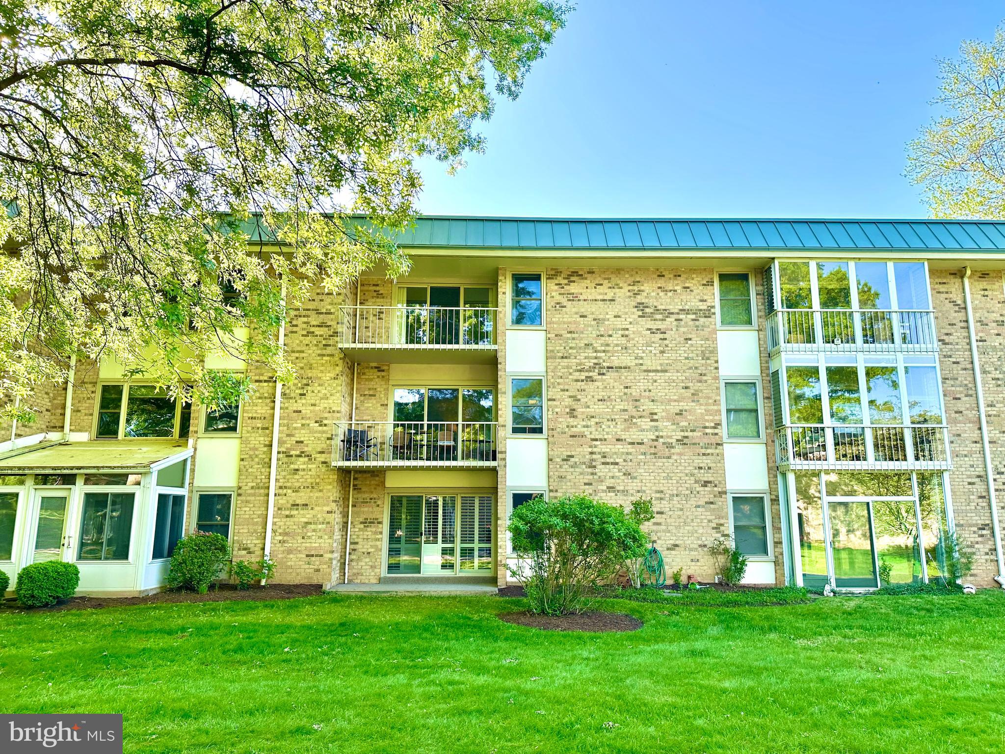 3350 Chiswick Court, Unit 573C Silver Spring, MD 20906 - Photo 25 of 43 a front view of a building with a garden