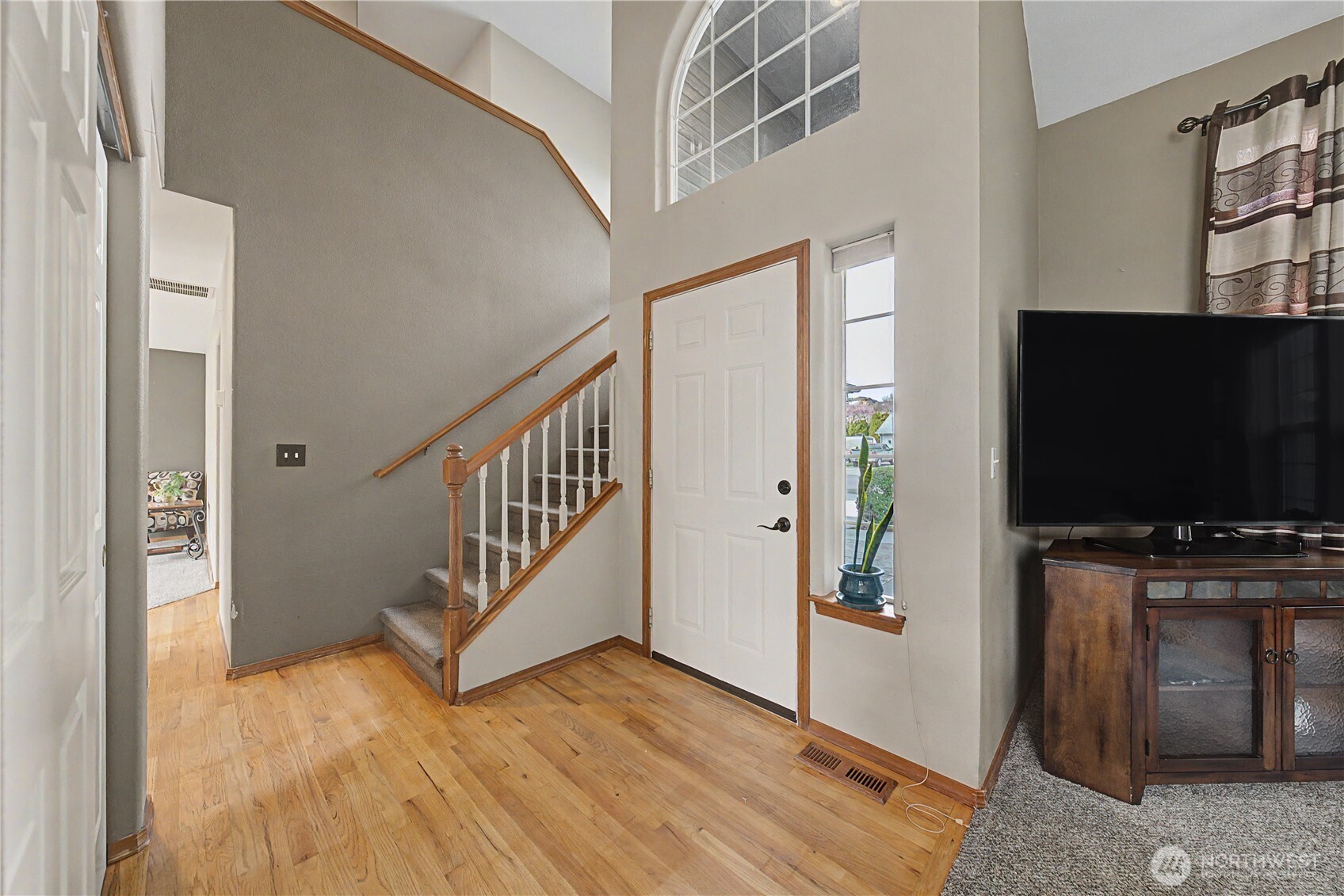 1929 Hideaway Place Wenatchee, WA 98801 - Photo 14 of 35 a view of a livingroom with wooden floor and a flat screen tv