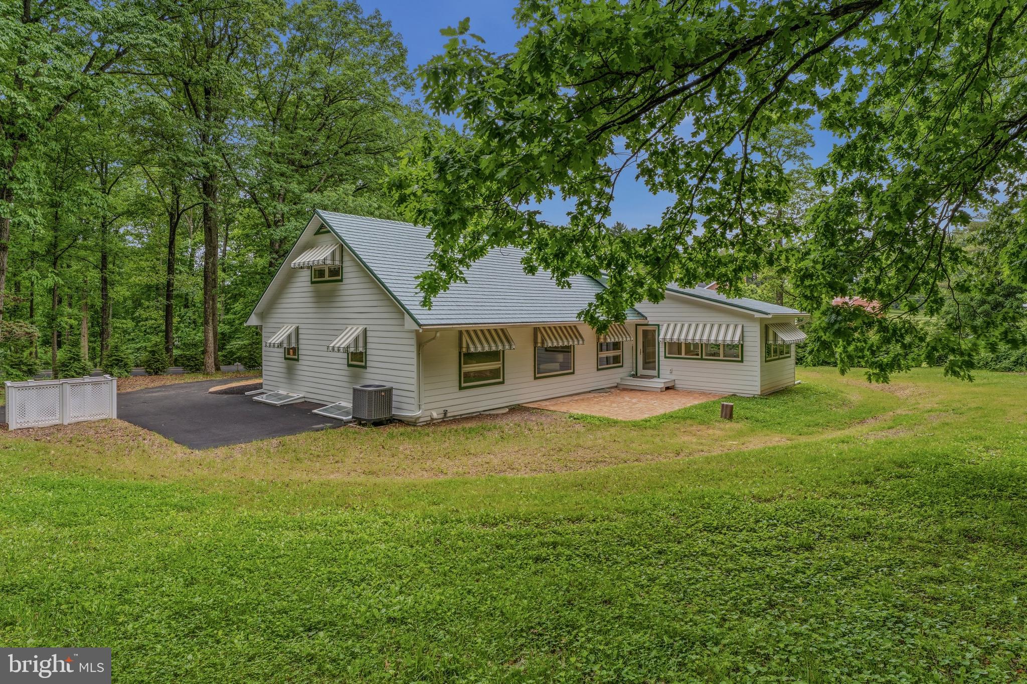 2425 Albert Rill Road Hampstead, MD 21074 - Photo 40 of 44 a front view of a house with yard and green space
