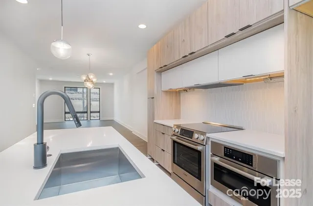 a kitchen with a stove and a refrigerator