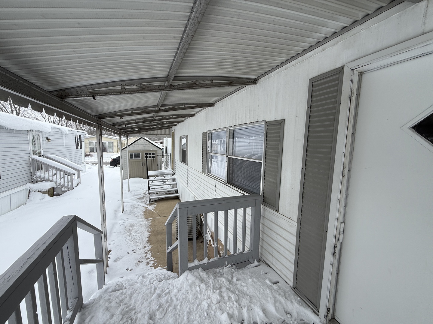 1712 South Dixie Highway, Unit 37 Crete, IL 60417 - Photo 5 of 16 a view of a hallway with wooden floor and staircase