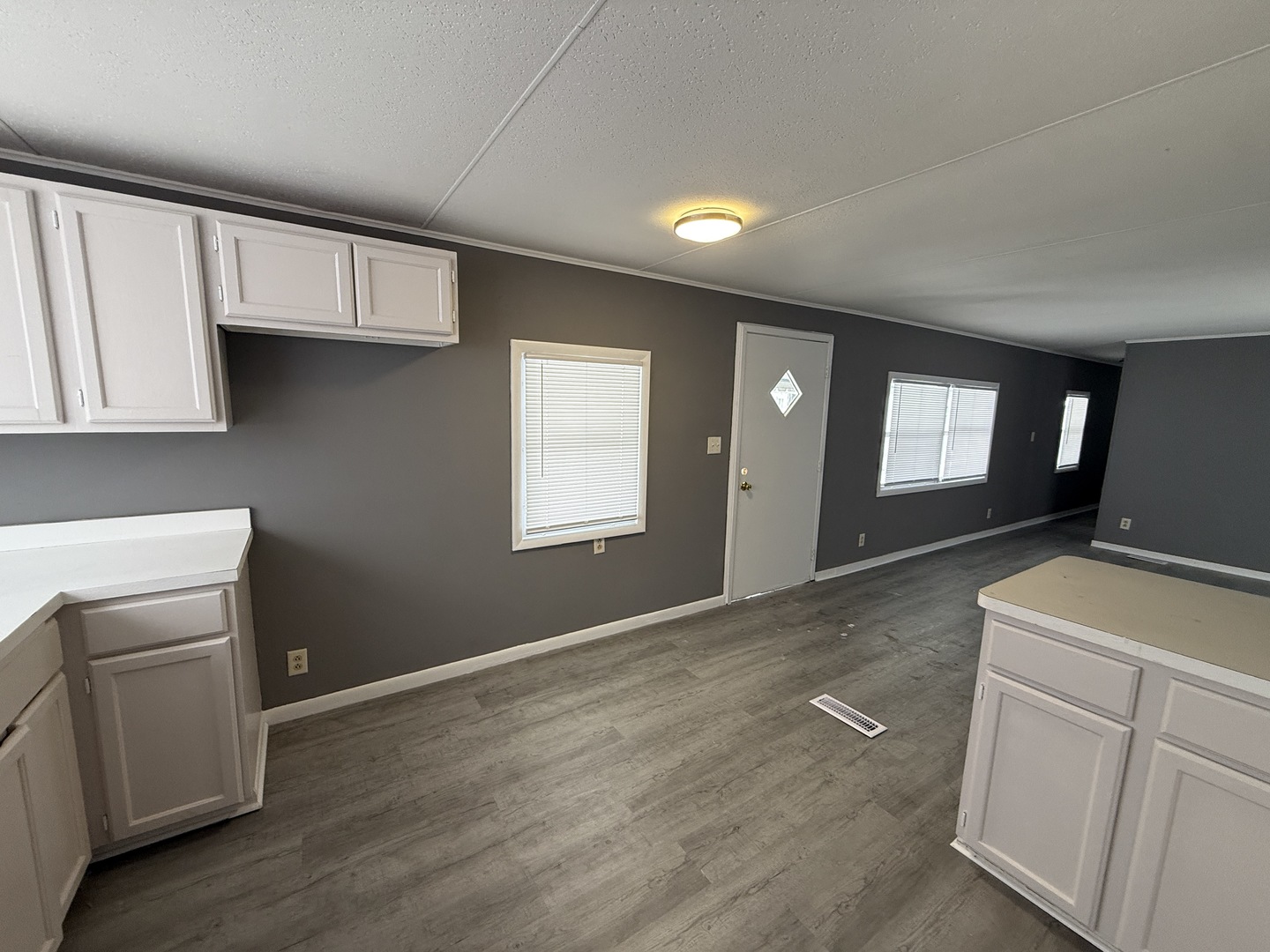 1712 South Dixie Highway, Unit 37 Crete, IL 60417 - Photo 6 of 14 a view of a kitchen with furniture and wooden floor