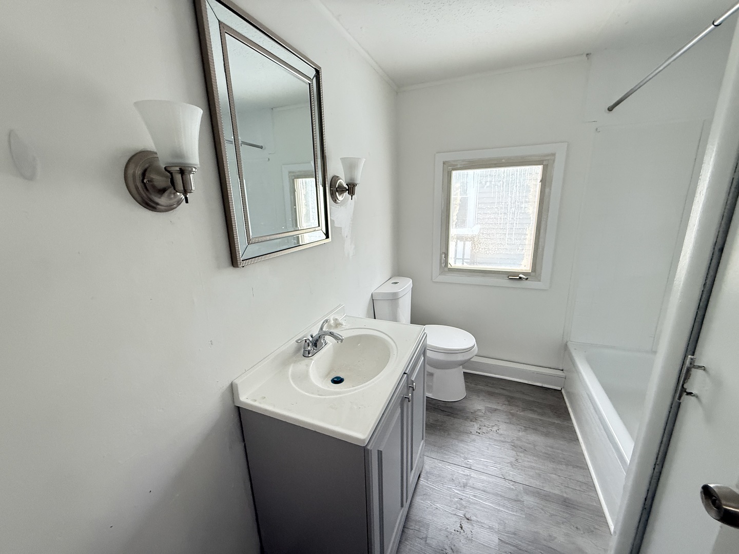1712 South Dixie Highway, Unit 37 Crete, IL 60417 - Photo 8 of 14 a bathroom with a sink and mirror with toilet