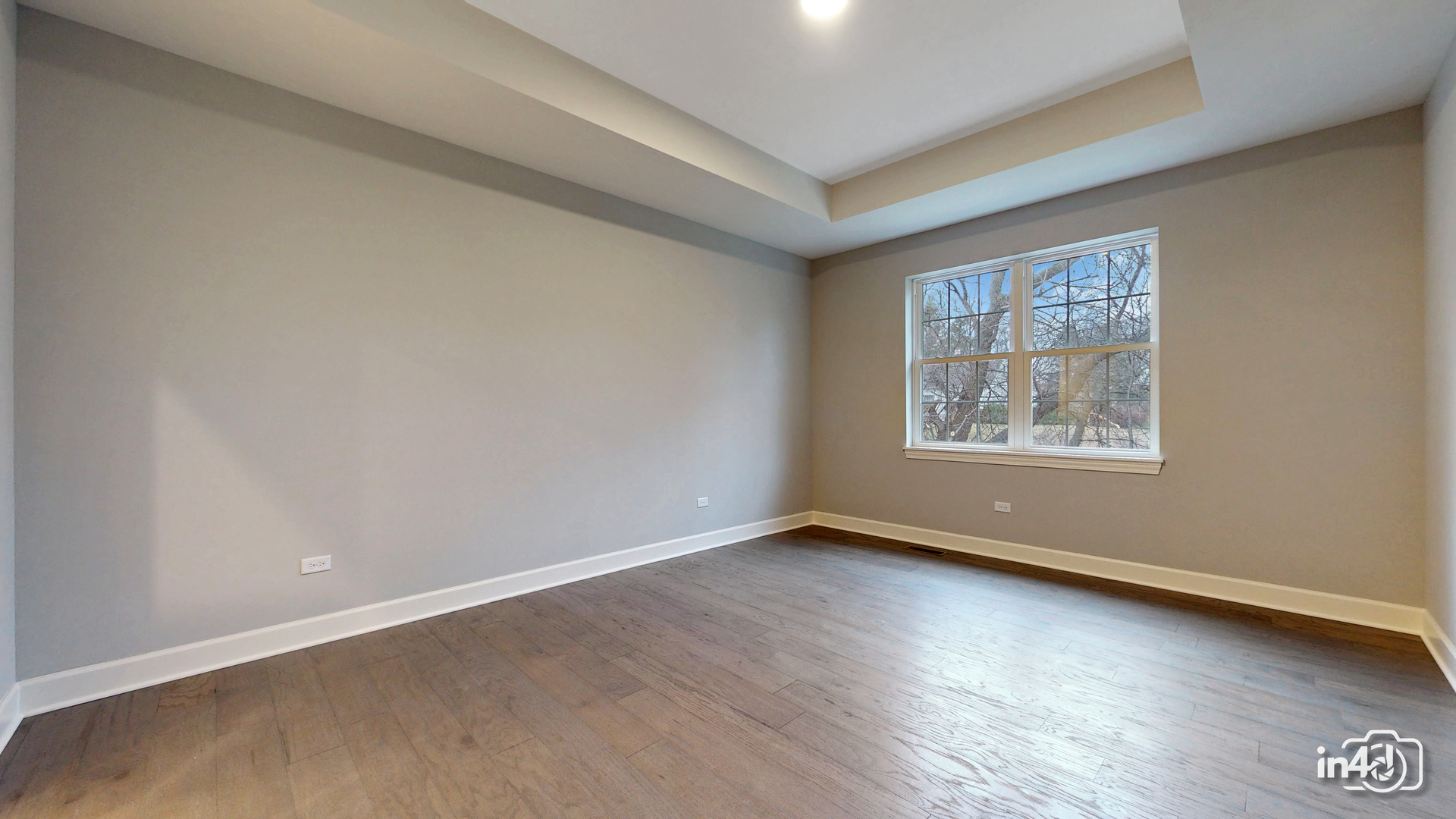 1431 Somerset Place Barrington, IL 60010 - Photo 12 of 28 an empty room with wooden floor and windows