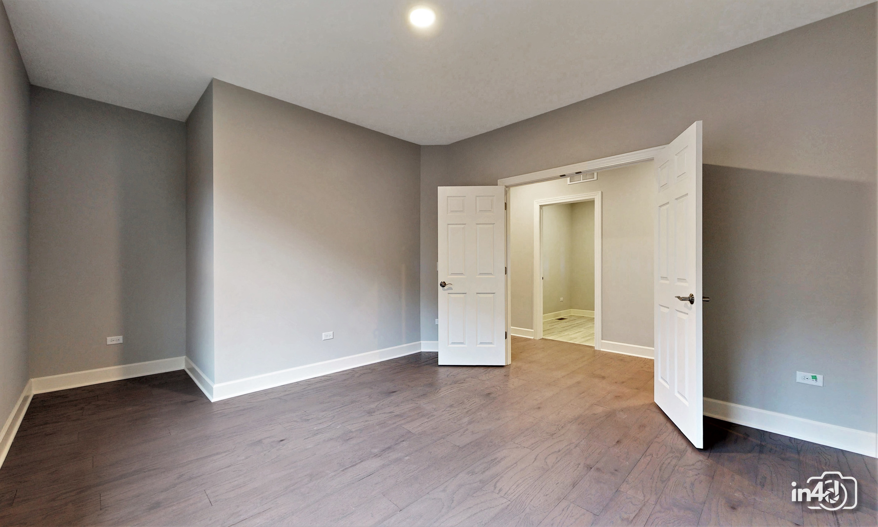 1431 Somerset Place Barrington, IL 60010 - Photo 23 of 28 a view of an empty room with wooden floor and closet