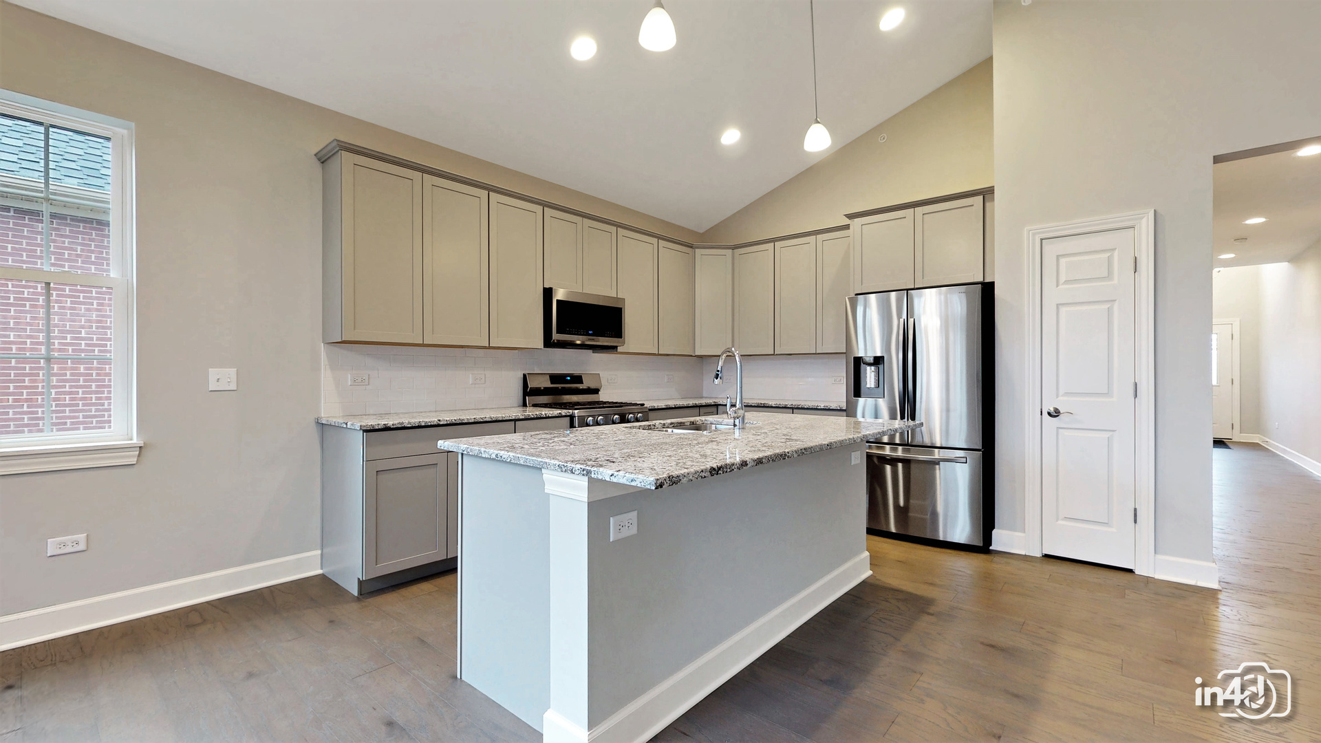 1431 Somerset Place Barrington, IL 60010 - Photo 6 of 28 a kitchen with a refrigerator a stove top oven a sink and cabinets