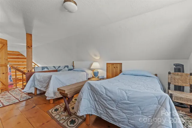 a bathroom with a sink a mirror and a shower