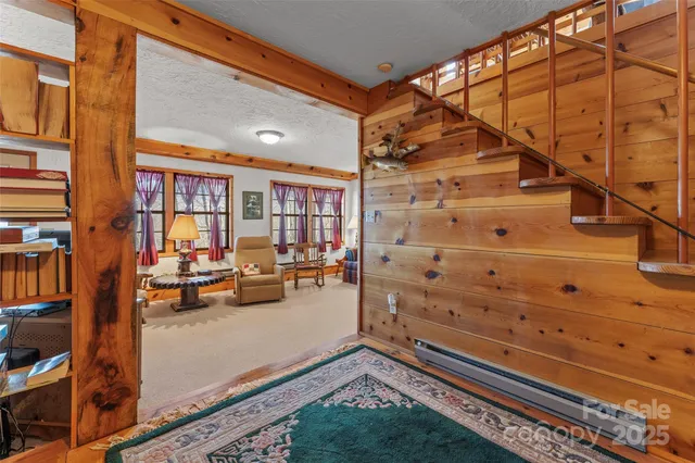 a living room with furniture ceiling fan and a window