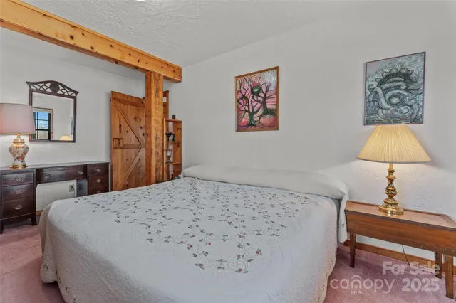a view of an entryway with wooden floor and door
