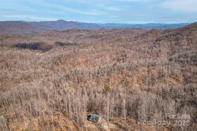 a aerial view of a house with table and chairs