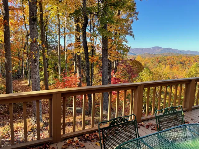 a view of a terrace with wooden floor and fence