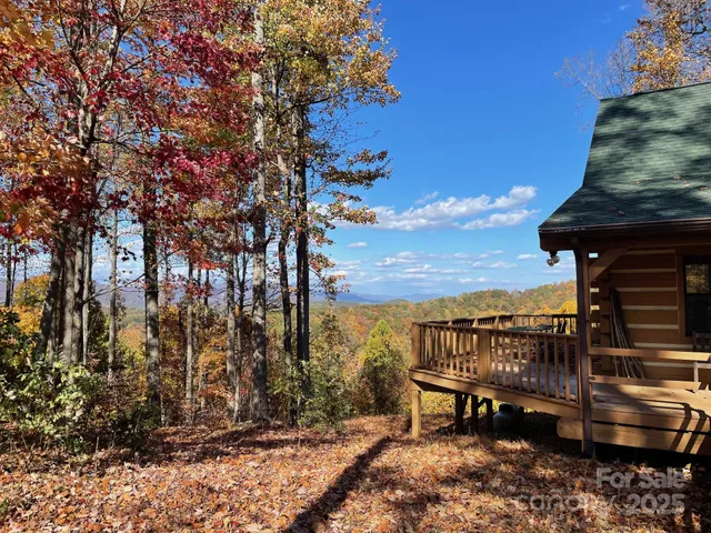 a living room with furniture a fireplace and a table