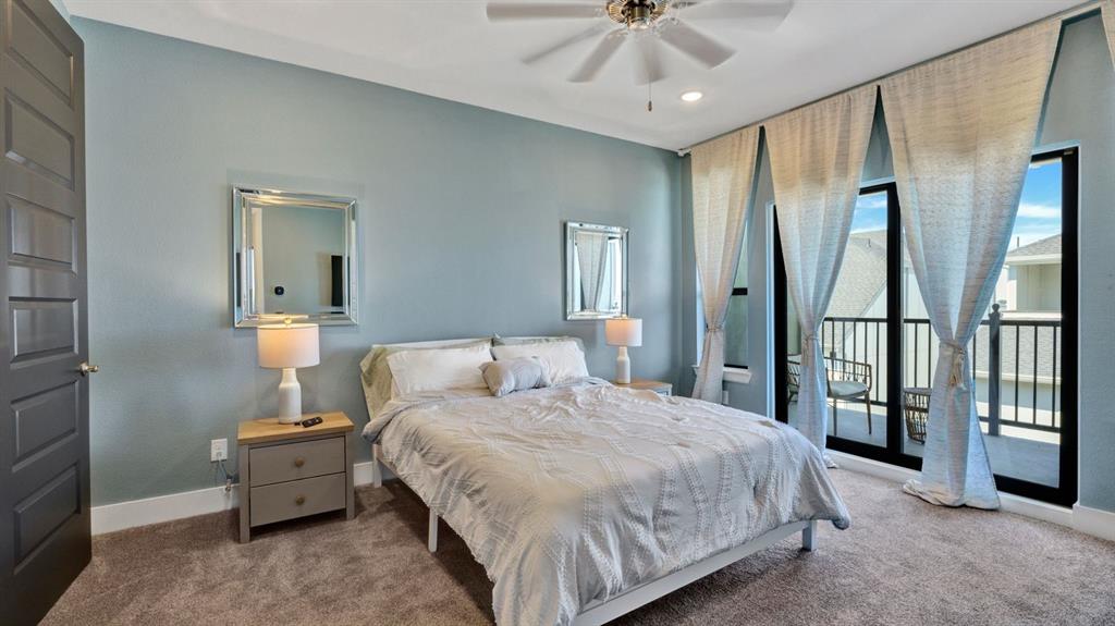 602 Winners Circle Rowlett, TX 75088 - Photo 11 of 28 Carpeted bedroom featuring ceiling fan, access to exterior, and recessed lighting