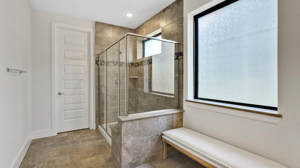 602 Winners Circle Rowlett, TX 75088 - Photo 17 of 28 Full bath featuring a shower stall and baseboards