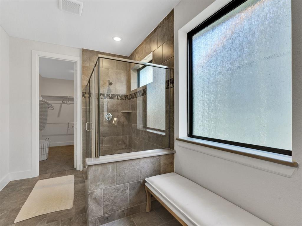602 Winners Circle Rowlett, TX 75088 - Photo 18 of 28 Bathroom featuring a walk in closet, a shower stall, tile patterned flooring, and recessed lighting