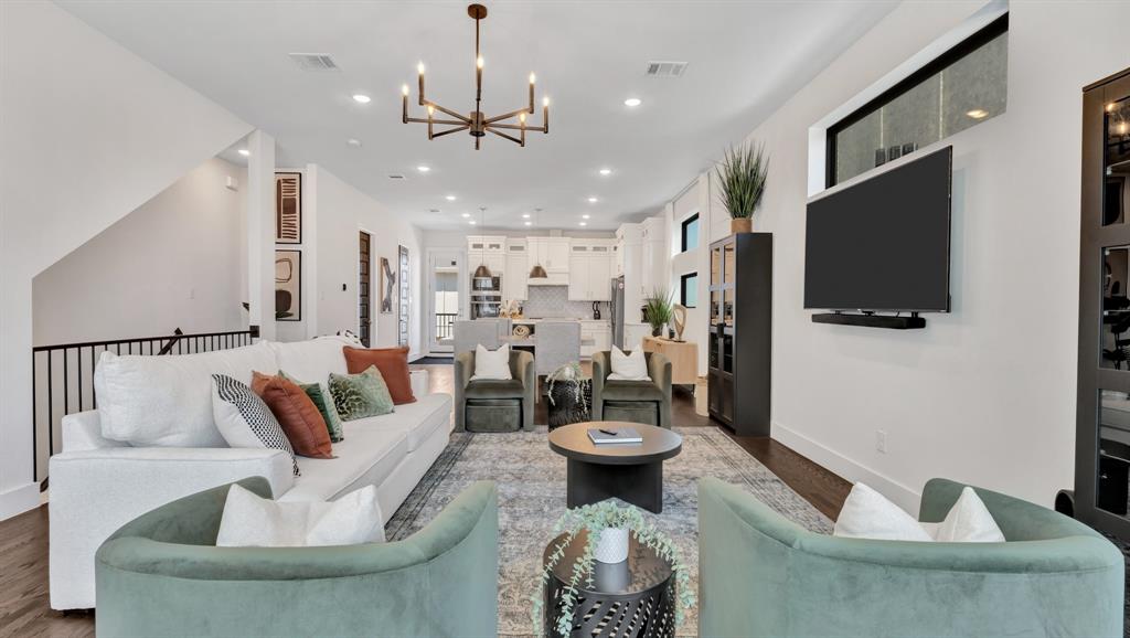 602 Winners Circle Rowlett, TX 75088 - Photo 4 of 28 Living room featuring a chandelier, recessed lighting, and wood finished floors