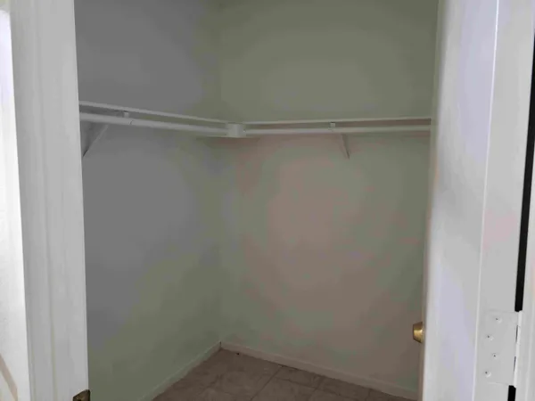 a view of an empty walk in closet