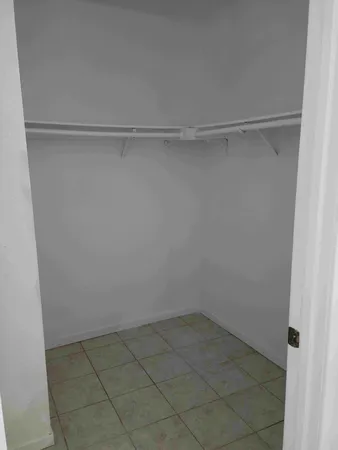 a view of an empty walk in closet
