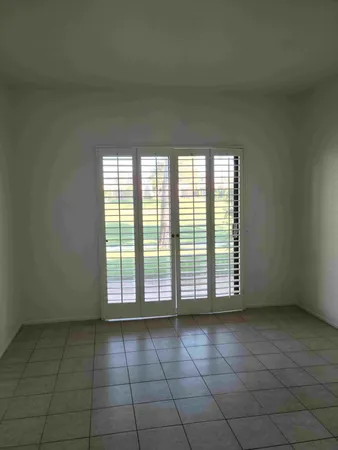 an empty room with a bathroom