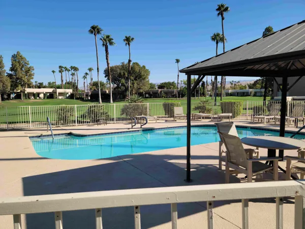 a view of a park with sitting area