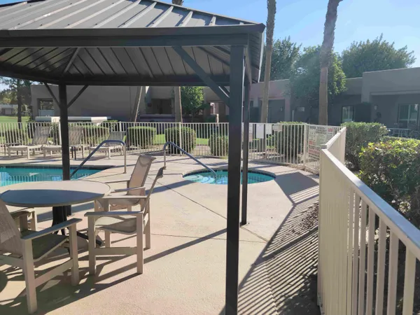 a view of balcony with wooden floor and outdoor seating