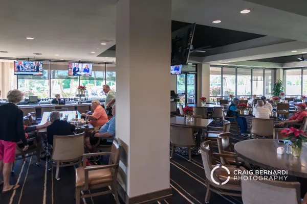 a room with musical instrument pool table and windows