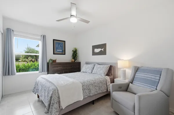 a bedroom with a large bed and a couch