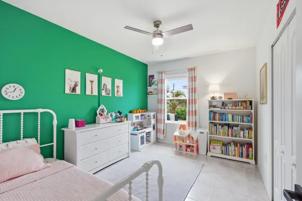 a living room with furniture and a book shelf