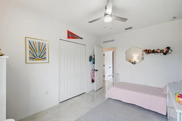 a view of a livingroom with wooden floor and hallway