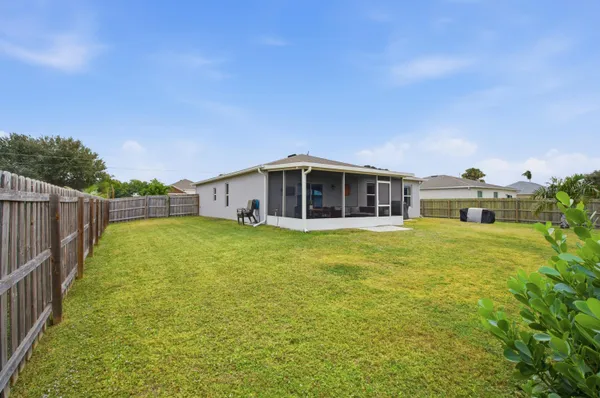 a house view with swimming pool in front of it