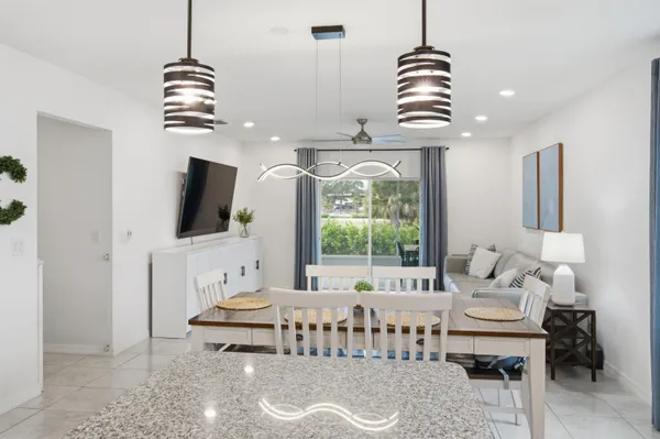 a bedroom with furniture and a flat screen tv