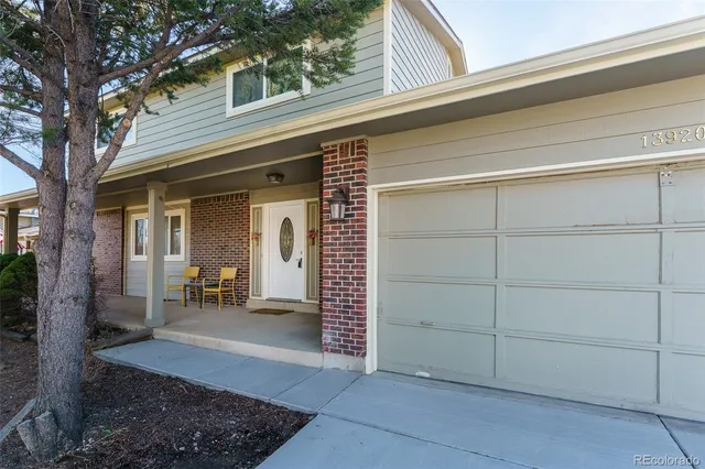 a view of a house with a chair and table