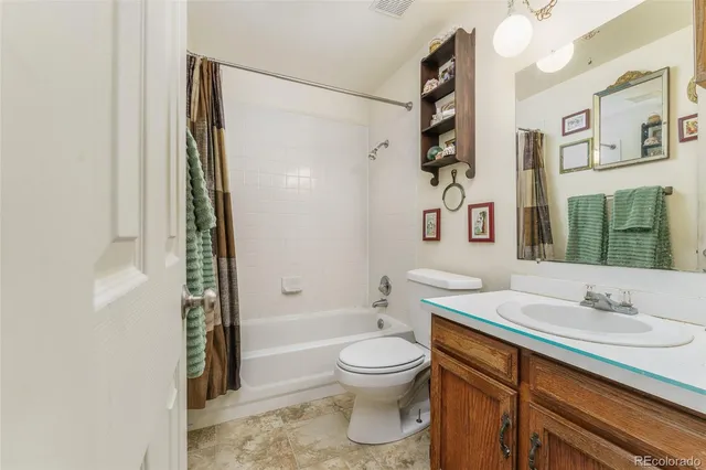 a bedroom with furniture and a chandelier