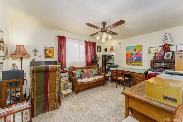 a room with gym equipment and view of living room