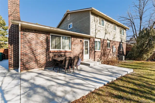 a view of a house with patio outdoor seating