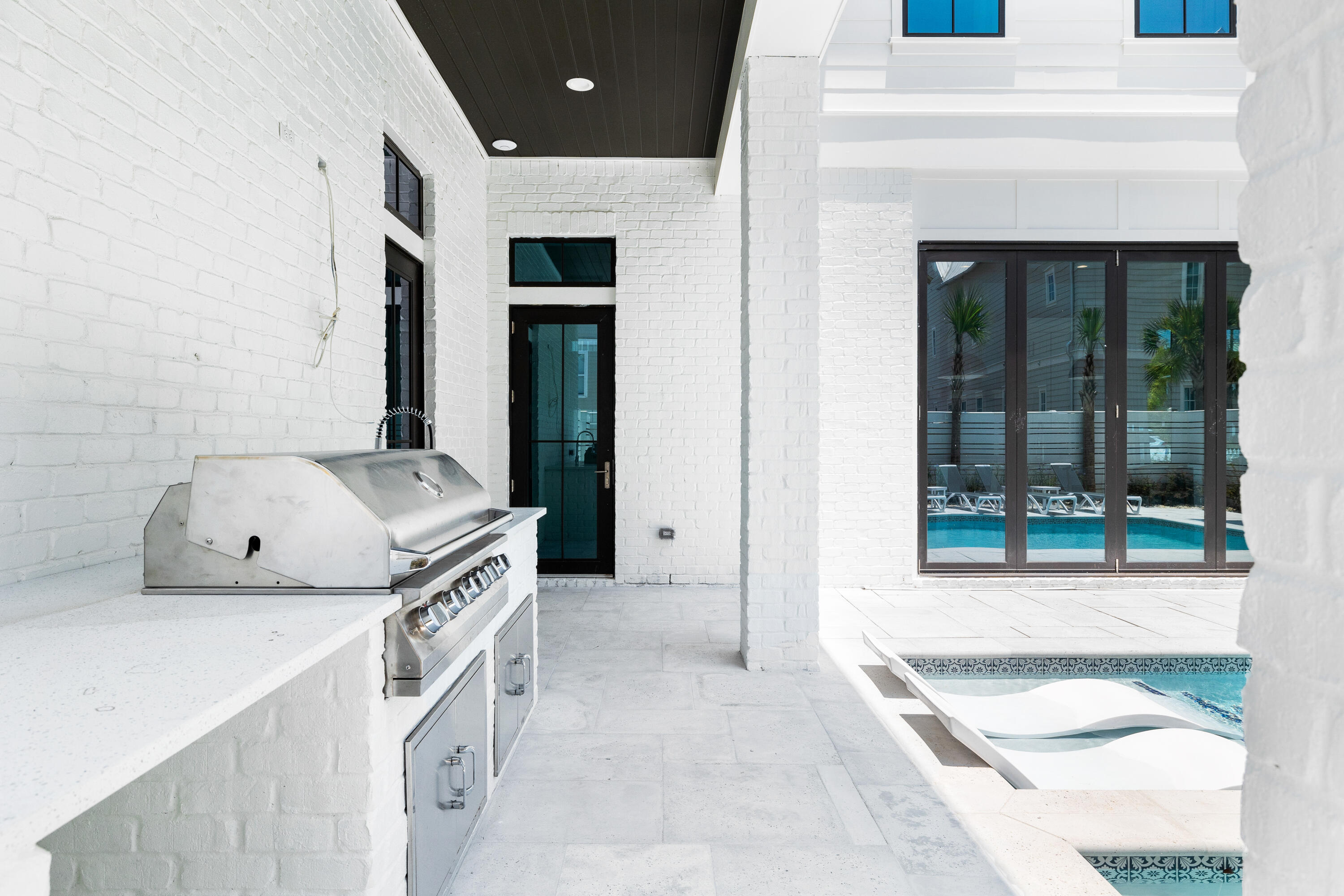 196 South Wall Street Inlet Beach, FL 32461 - Photo 14 of 85 a kitchen with a stove and a white cabinet