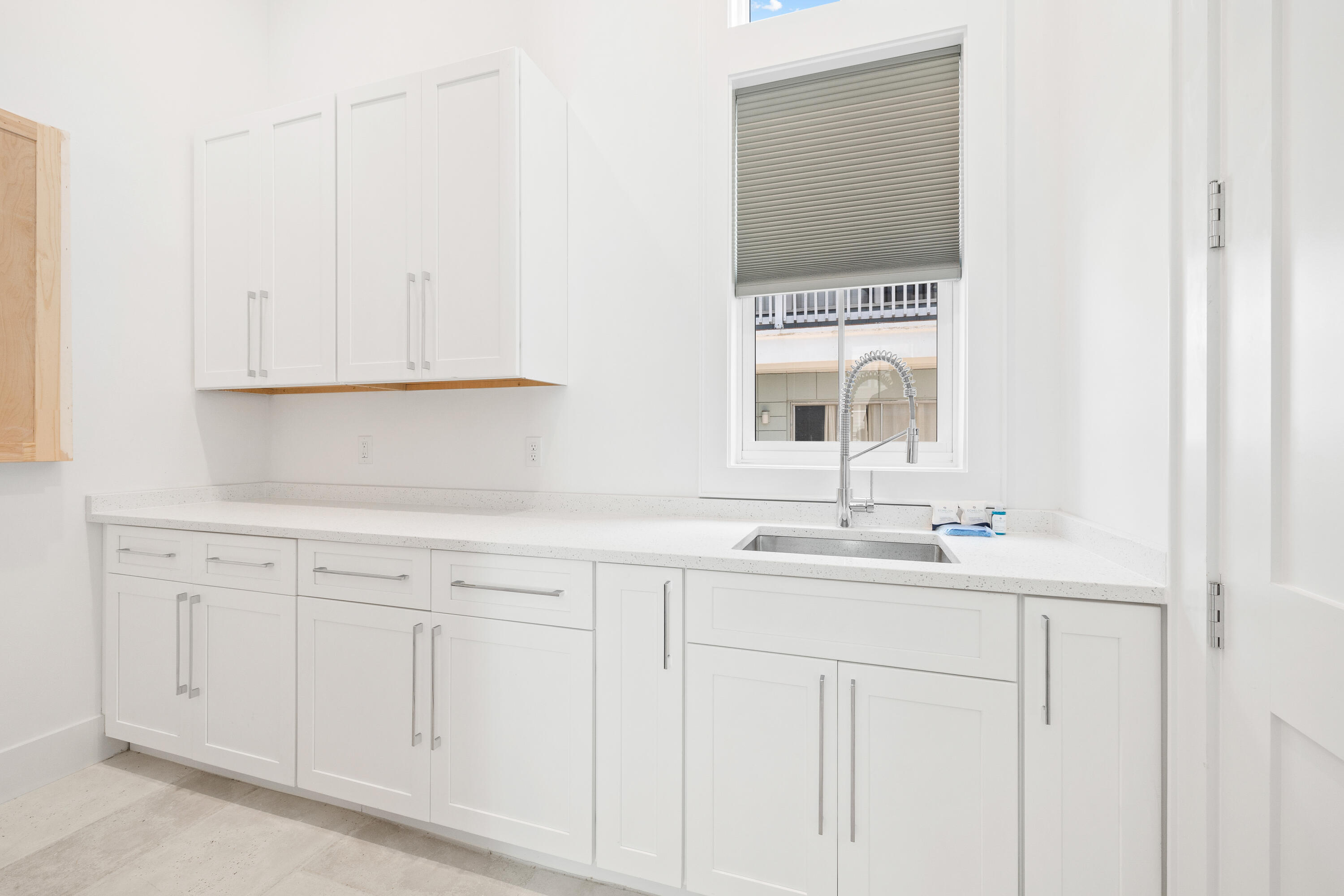 196 South Wall Street Inlet Beach, FL 32461 - Photo 28 of 85 a kitchen with white cabinets and sink