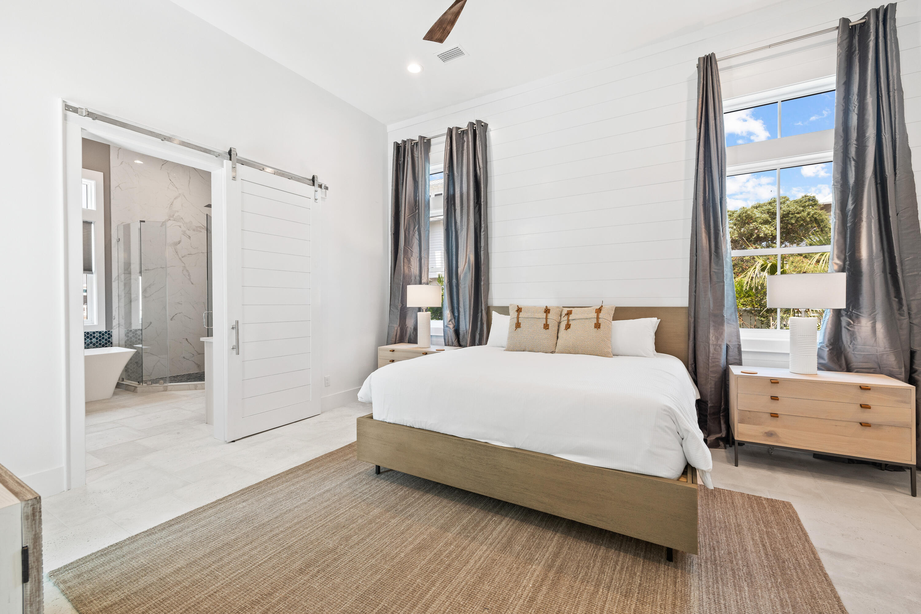 196 South Wall Street Inlet Beach, FL 32461 - Photo 29 of 85 a spacious bedroom with a bed and a couch